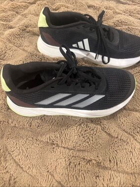 adidas Black Athletic Running Shoes with White Stripes and Neon Yellow Accents